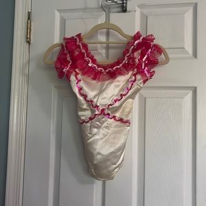 Pink and white sequined and lace leotard